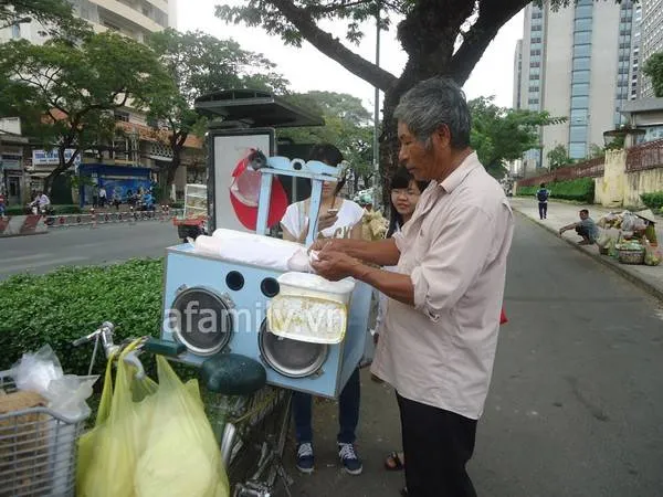 alt: Người thợ đang kéo sợi kẹo tơ hồng