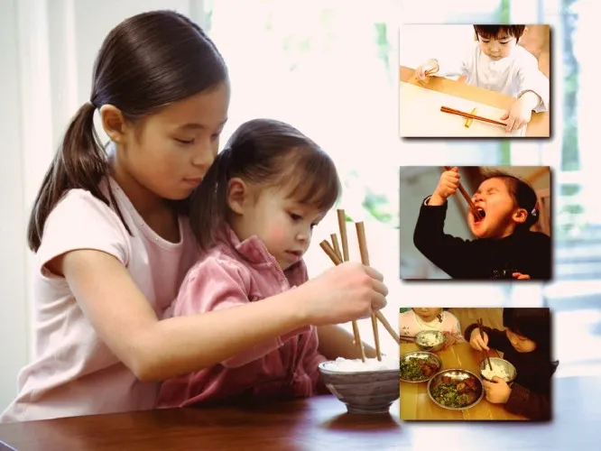 Bé tập cầm đũa