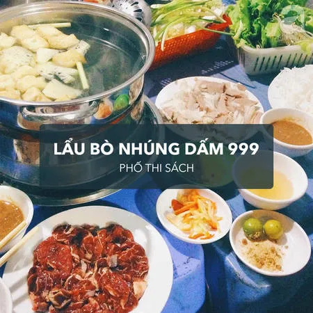 Nồi lẩu bò nhúng dấm với nước dùng chua ngọt, thịt bò tươi ngon.