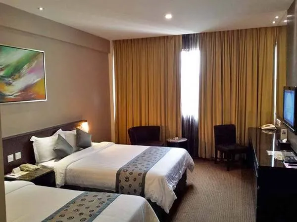 Phòng ngủ tại khách sạn Royal Singapore